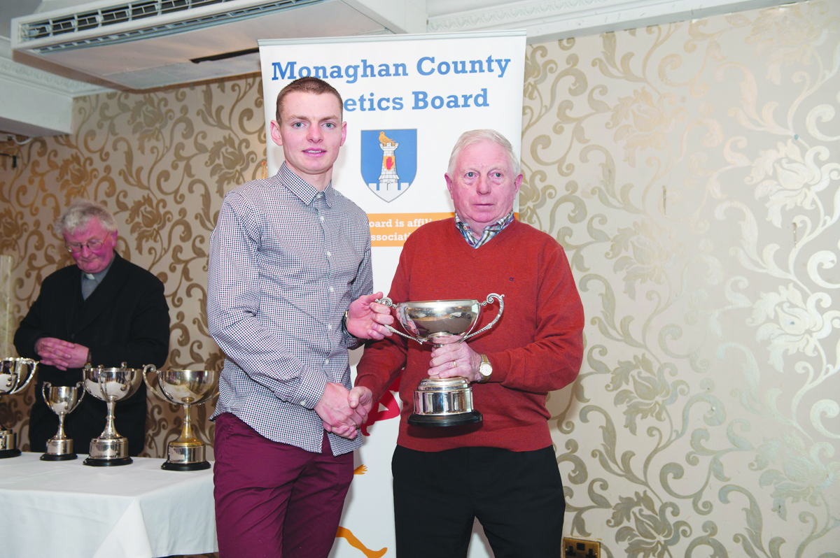 Patsy Kelly, right, making the presentation of the Cup for the Senior Mens Road League to winner, Conor Duffy, Glaslough Harriers. Â©Rory Geary/The Northern Standard