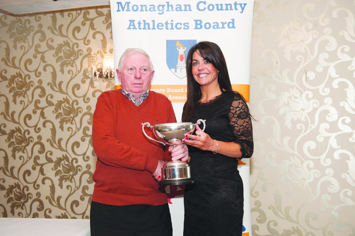 Winner of the Ladies 35-45 Road League, Elaine Walls, Carrick Aces, being presented with her cup by Patsy Kelly. Â©Rory Geary/The Northern Standard