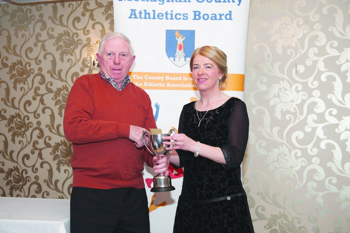 Audrey Harraghey, Monaghan Phoenix AC, who was the winner of the Ladies 45+ Road League, being presented with the cup by Patsy Kelly. Â©Rory Geary/The Northern Standard