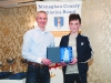 Chairman of the Monaghan County Athletics Board, Alan Clarke, left, making the presentation to Conor Maguire. Â©Rory Geary/The Northern Standard