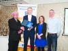 Fr Paudge Corrigan, making the presetation to Paul Peppard, Monaghan Phoenix AC. Also included are Rose Lambe and Alan Clarke, Chairman of the Monaghan County Athletics Board. Â©Rory Geary/The Northern Standard