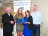 Leah Barry, 2nd from left, accepting the presentation on behalf of Niamh Malone, Monaghan Phoenix AC, from Rose Lambe. Also included are Fr Paudge Corrigan and Chairman of the Monaghan County Athletics Board, Alan Clarke. Â©Rory Geary/The Northern Standard