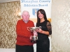 Winner of the Ladies 35-45 Road League, Elaine Walls, Carrick Aces, being presented with her cup by Patsy Kelly. Â©Rory Geary/The Northern Standard