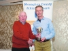 Winner of the Mens 50+ Road League, Mark Macklin, Monaghan Town Runners, being presented with the cup by Patsy Kelly. Â©Rory Geary/The Northern Standard