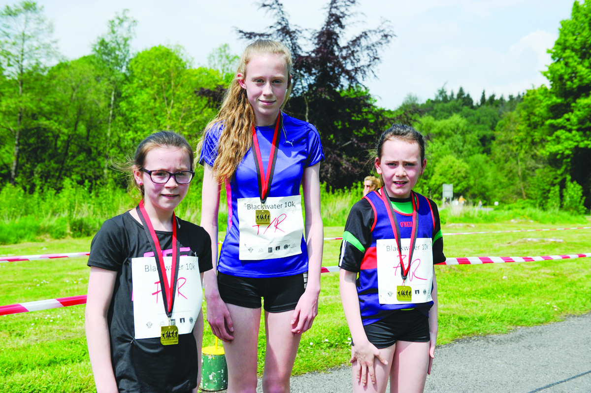 Winner of the ladies 3k Sarah Glynn, centre, Monaghan Phoenix AC, with Yasmin O'Leary, 2nd and Amy Jo Kearns, right, Oriel 3rd. Â©Rory Geary/The Northern Standard
