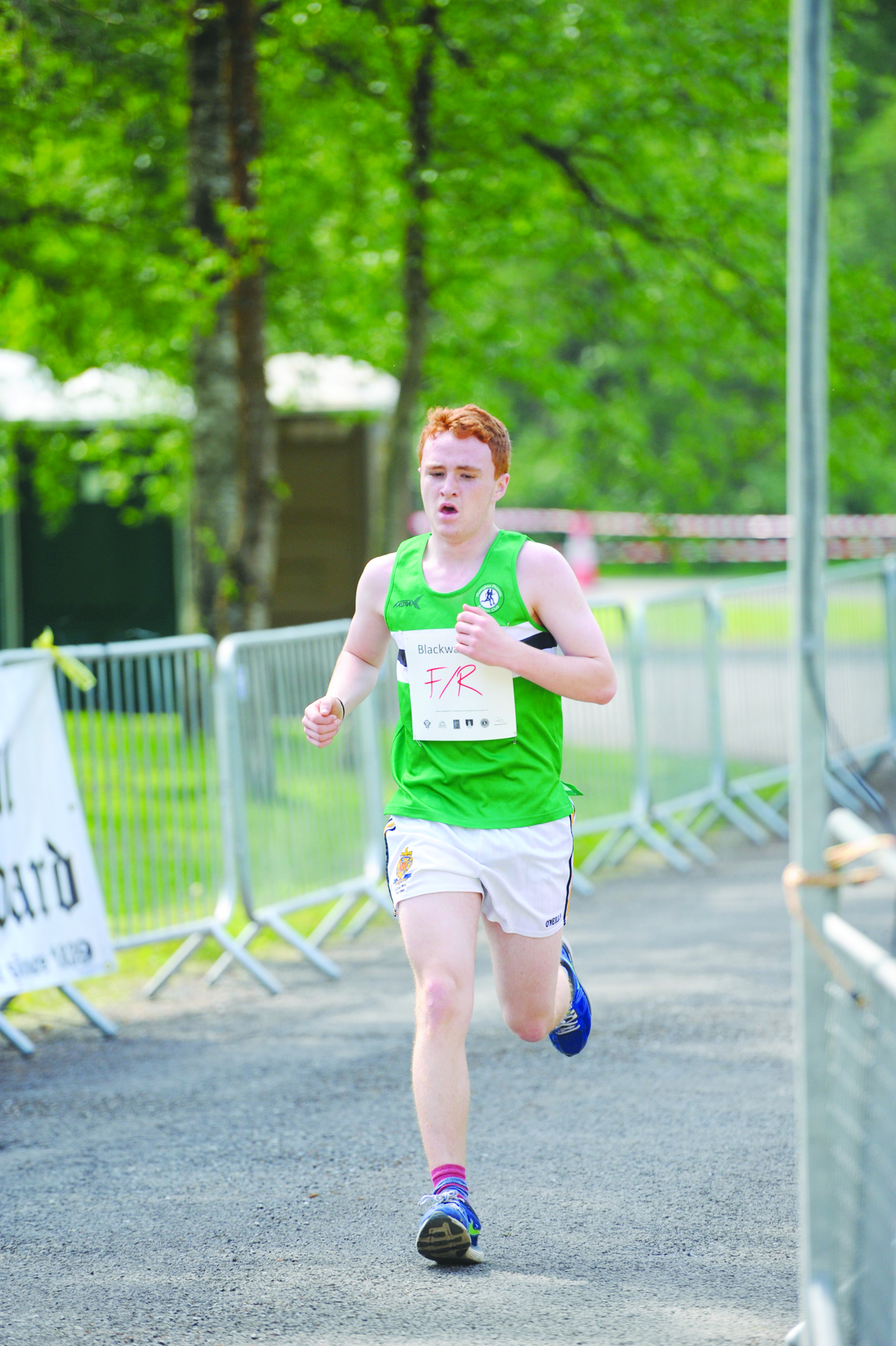 Oisin Fagan from Monaghan Phoenix AC finishing the 3k in 3rd place. Â©Rory Geary/The Northern Standard