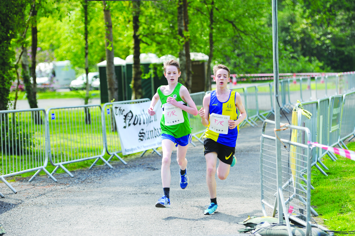 Andrew McKenna, Monaghan Phoenix AC and Jamie McMahon, Clones AC, finishing the 3k funrun together in 1st place. Â©Rory Geary/The Northern Standard
