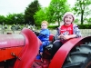 Ryan McPhillips and Kayla Treanor on one of the vintage tractors at the Carrickroe Welcome Home Festival tractor run. Â©Rory Geary/The Northern Standard