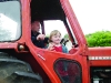 One of the participants in the tractor run waving to the crowd at the Carrickroe Welcome Home Festival. Â©Rory Geary/The Northern Standard