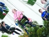 Some of the crowd on one of the fairground rides at the Carrickroe Welcome Home Festival sports day. Â©Rory Geary/The Northern Standard