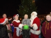 Michelle Reinhart-McCabe, centre, switching on the Clones Town Christmas Lights, with help from Mr and Mrs Santa Claus, at the switch-on event last weekend. Â©Rory Geary/The Northern Standard