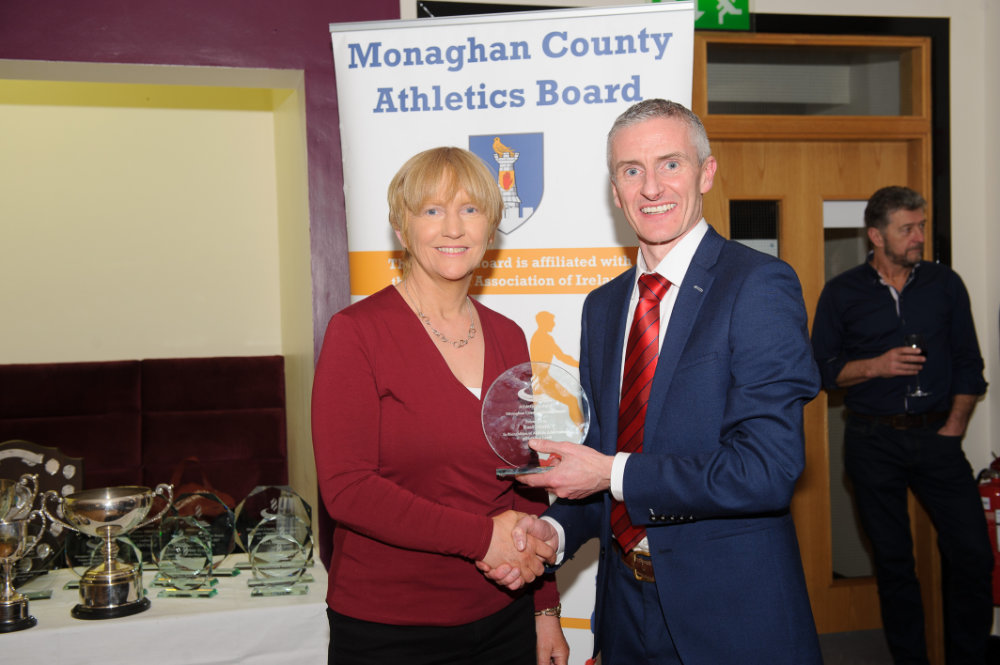Alan Clarke, chairman of the Monaghan County Athletics Board, making the presentation to Una McMahon, Monaghan Phoenix AC. Â©Rory Geary/The Northern Standard