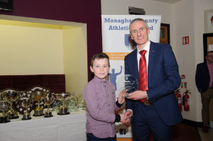 James McQuaid, Glaslough Harriers, being presented with his award by Alan Clarke, chairman of the Monaghan County Athletics Board. Â©Rory Geary/The Northern Standard