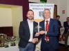 Ross Miotti, Monaghan Phoenix AC, being presented with his award by Alan Clarke, chairman of the Monaghan County Athletics Board. Â©Rory Geary/The Northern Standard