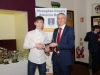 Conor Maguire, left, Monaghan Phoenix AC, accepting his award from Alan Clarke, chairman of the Monaghan County Athletics Board. Â©Rory Geary/The Northern Standard
