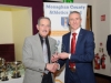 Anglo McNally, left, Monaghan Town Runners, being presented with his award by Alan Clarke, chairman of the Monaghan County Athletics Board. Â©Rory Geary/The Northern Standard