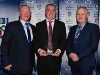 Garreth Coyle receives his Retirement Award from Cathal Smyth (Northern Standard) and Michael Owen McMahon (Co. Board Chairman) Â© Northern Standard