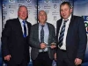 Cathal Smyth and Padraig Sherry present Anthony McKenna with his Special Merit Award. Â© Northern Standard