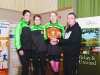 Noel Kennedy making the presentation of the Ken Kennedy Shield for the Senior Ladies Team to Elaine Walles, Rose Lambe and Ann Linden from Carrick Aces. Â©Rory Geary/The Northern Standard