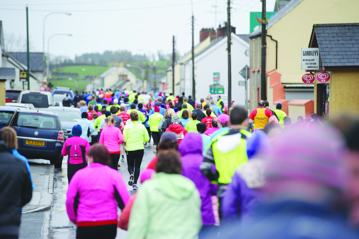 Some of the crowd taking part in the Glaslough Harriers Jolly Joggers Run on New Years Day, making their way along the Emyvale Main Street. Â©Rory Geary/The Northern Standard