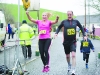 Rebecca Irwin, celebrates as she crosses the finish line with John Cuddy. Â©Rory Geary/The Northern Standard