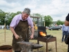 Peter Cassidy giving a demonstration of traditional blacksmithing skills during the day. Â©Rory Geary/The Northern Standard
