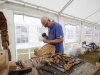 Arty Cadden giving a demonstration of hand-carving wood during the day. Â©Rory Geary/The Northern Standard