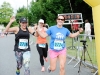 Danielle Corrigan and Laura McCann, crossing the finishline of the 5 Mile race together. Â©Rory Geary/The Northern Standard