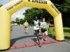 Winner of the Monaghan 10 Miler, Freddie Sittuk, Raheny, crossing the finishline, just ahead of Conor Duffy, Glaslough Harriers. Â©Rory Geary/The Northern Standard