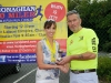 Colm Mahoney, Monaghan Town Runners, making the presentation to Patrica Brown, runner-up in the Ladies 5 Mile Race. Â©Rory Geary/The Northern Standard