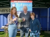 Tydavnet Show Queen Shauna McAree, left and President of Tydavnet Show, Mary Sherry, right, presenting Patrick Rushe, with the Sir Shane Leslie Cup for Vegatables. Â©Rory Geary/The Northern Standard