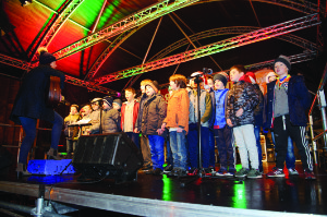 Members of the choir from Gaelscoil Ultain on stage at the Monaghan Town Christmas Lights Switch-On. Â©Rory Geary/The Northern Standard
