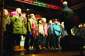 Some of the members of the choir from Gaelscoil Ultain on stage at the Monaghan Town Christmas Lights Switch-On. Â©Rory Geary/The Northern Standard