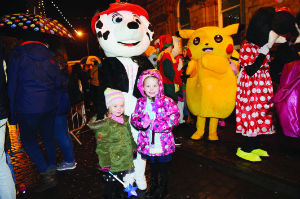 Jessica and Madison White with Marshall of Paw Patrol at the Monaghan Town Christmas Lights Switch-On. Â©Rory Geary/The Northern Standard