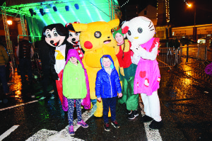 Lauren and Nevin McKenna with some of the characters that attended the Monaghan Town Christmas Lights Switch-On last Sunday. Â©Rory Geary/The Northern Standard