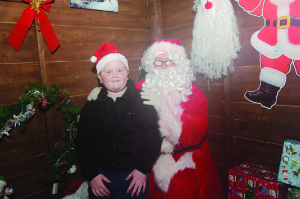 Cillian Caulfield with Santa at the Monaghan Town Christmas Lights Switch-On. Â©Rory Geary/The Northern Standard